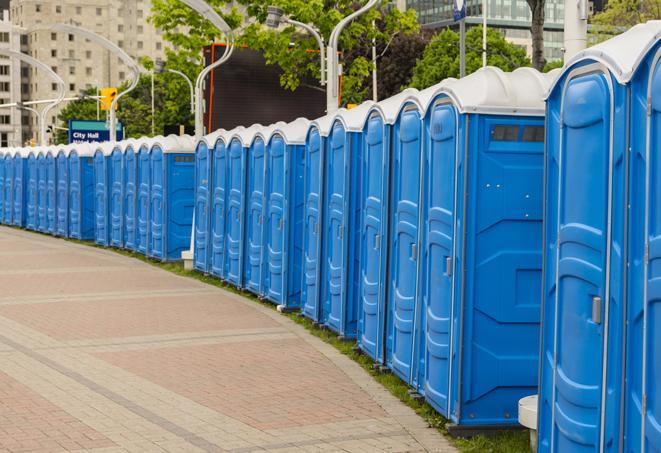 a row of portable restrooms set up for a special event, providing guests with a comfortable and sanitary option in Briny Breezes